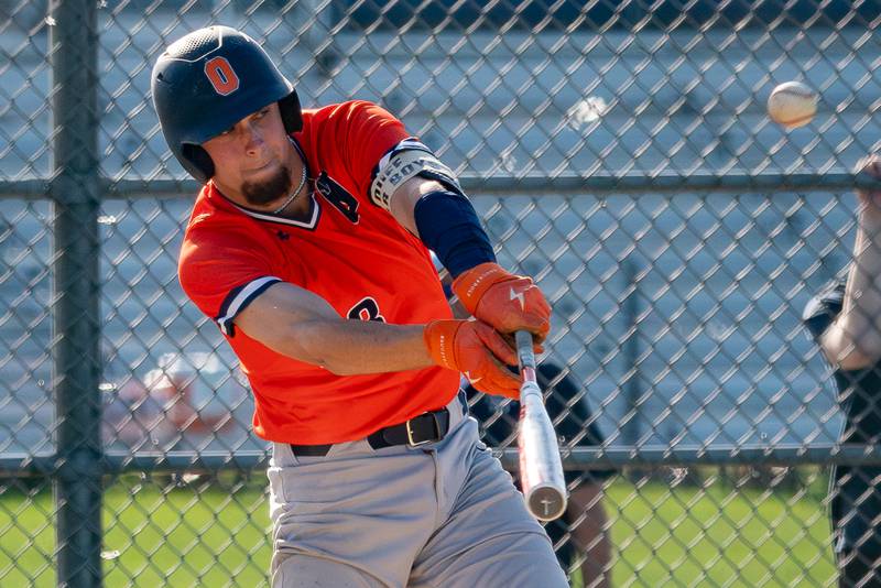 Oswego’s Cade Duffin (23) drives in a run on a sac fly against Oswego East during a baseball game at Oswego East High School on Wednesday, May 10, 2023.