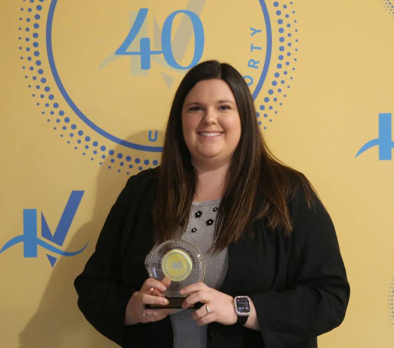 Kaylee Sienza-Duncan poses with her award during the 40 Under Forty awards banquet on Thursday, March 21, 2024 at Westclox in Peru.