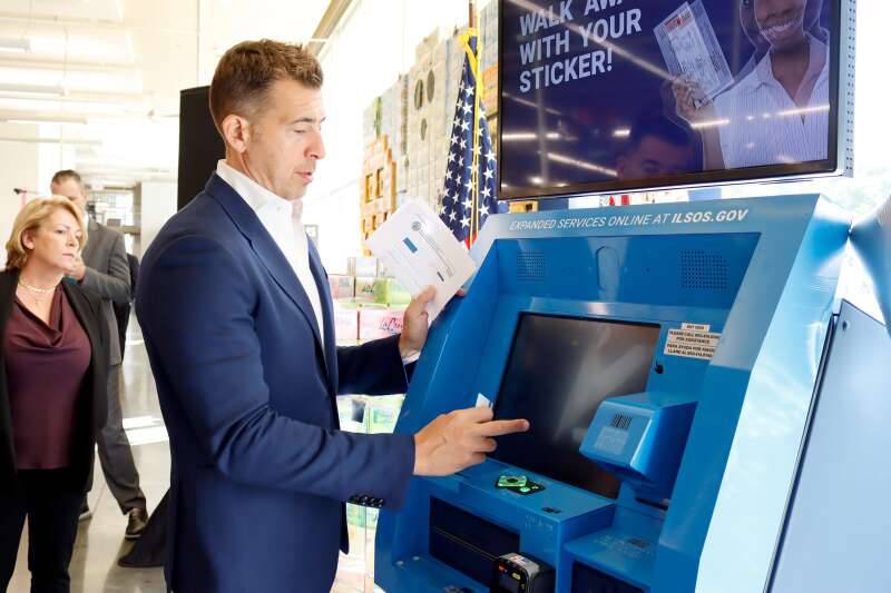 Secretary of State Alexi Giannoulias demonstrates a new kiosk for driver's services Thursday, Oct. 17, 2024, in Chicago.