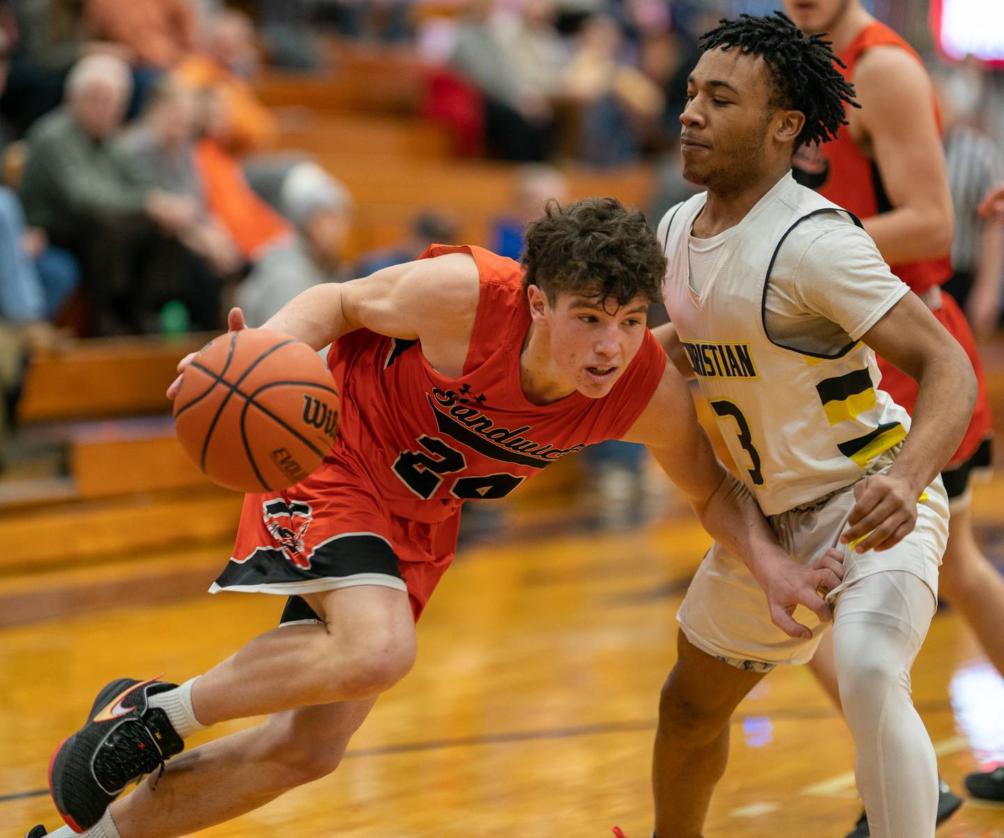 Sandwich’s Evan Gottlieb (24) drives to the basket against Yorkville Christian's Abram Fields (3) during the 59th Annual Plano Christmas Classic basketball tournament at Plano High School on Tuesday, Dec 27, 2022.