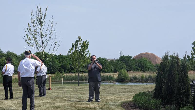 Michael Creasey of Joliet plays taps at the end of Crest Hill's Memorial Day ceremony on Monday, May 29, 2023 in Crest Hill. Creasey first played taps at the Crest Hill event with his grandfather Joseph Gutierrez, a World War II veteran, when Creasey was just 11 years old. Creasey has played ever since.