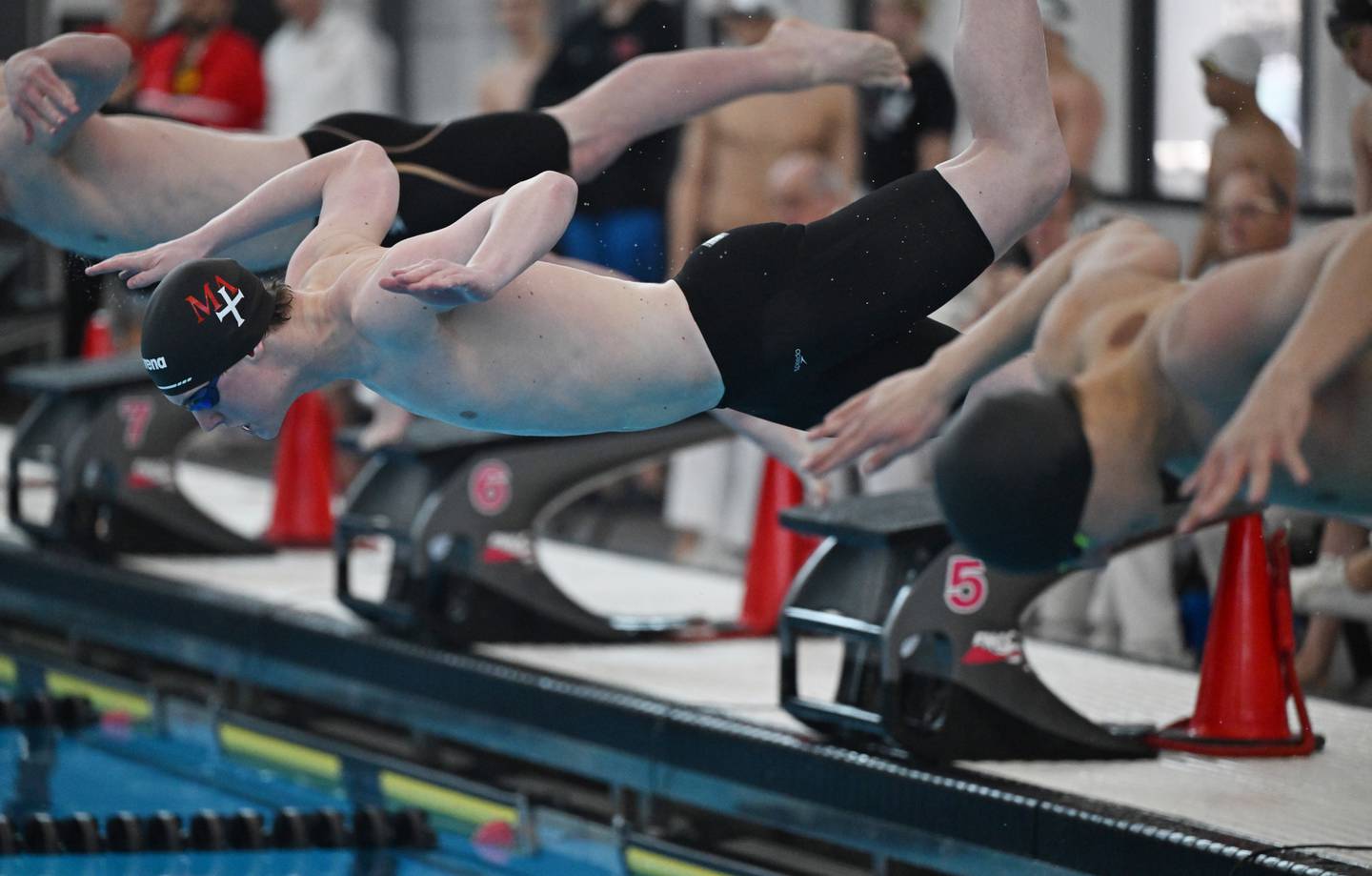 Marmion’s Braden Nagel leaves the starting block in the 400-yard freestyle relay during the boys state swimming and diving finals at the FMC Natatorium on Saturday, Feb. 28, 2026 in Westmont.