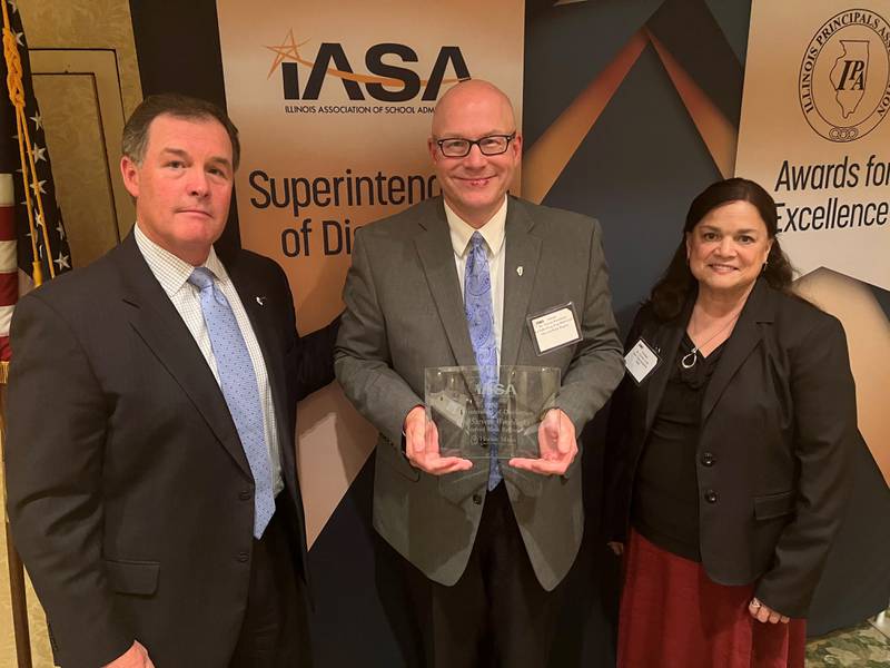 La Salle-Peru High School Superintendent Steven Wrobleski was one of 21 superintendents honored as a "Superintendent of Distinction." Wrobleski (center) is photographed with IASA Executive Director Brent Clark (left) and State Superintendent Carmen Ayala.