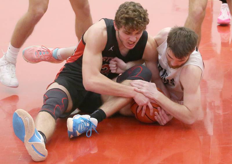 Stillman Valley's Ethan Szarkowicz and St. Bede's Mason Ross force a jump ball during the 49th annual Colmone Class on Thursday, Dec. 7, 2023 at Hall High School.