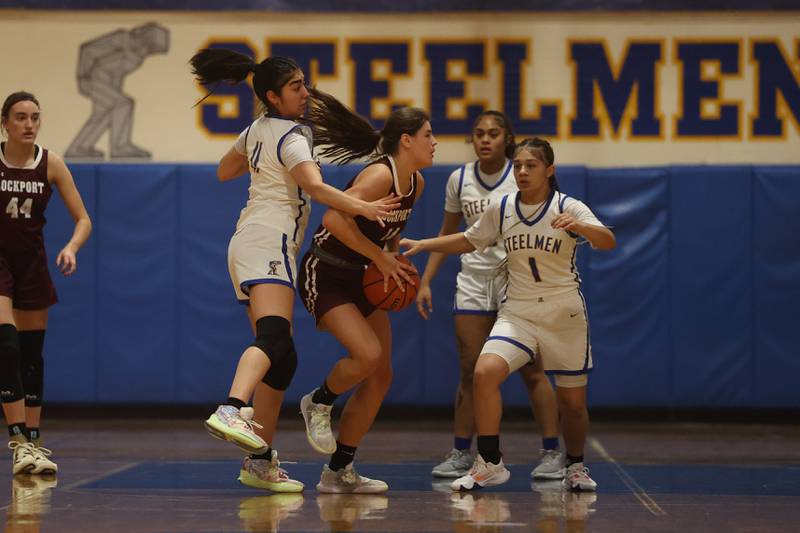 Lockport’s Veronica Bafia pulls in the rebound against Joliet Central.