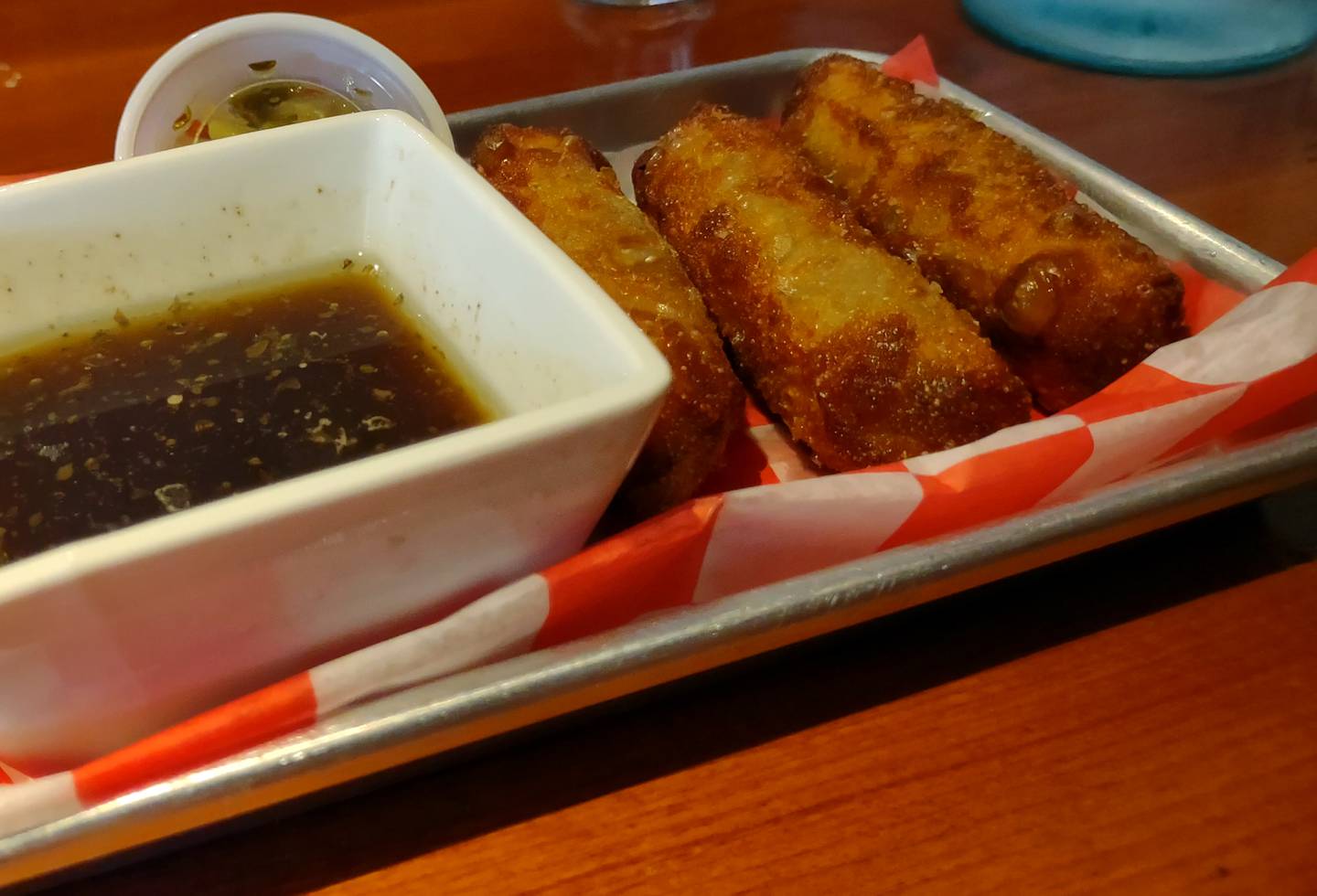 One of the popular appetizer menu items is the Italian beef egg roll served with au jous.