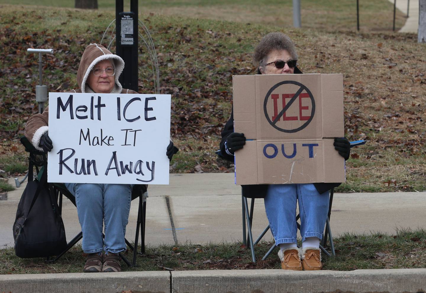 Protesters hold signs during a "ICE Out For Good" protest on Saturday, Jan. 10, 2026 at Rotary Park in Princeton. The Bureau County Democrats organized the event. About two-dozen protesters gathered to protest the ICE officer who shot and killed Renee Nicole Good in Minneapolis on Jan. 7.