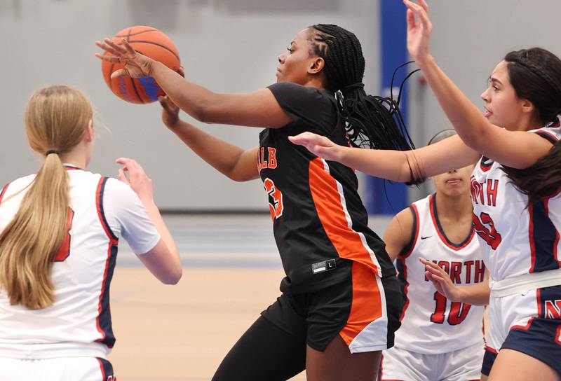 DeKalb’s Cayla Evans passes the ball out of the post during their game against Belvidere North Friday, Nov. 17, 2023, in the Mark Einwich Varsity Girls Basketball Rockets Kickoff Tournament at Burlington Central High School.