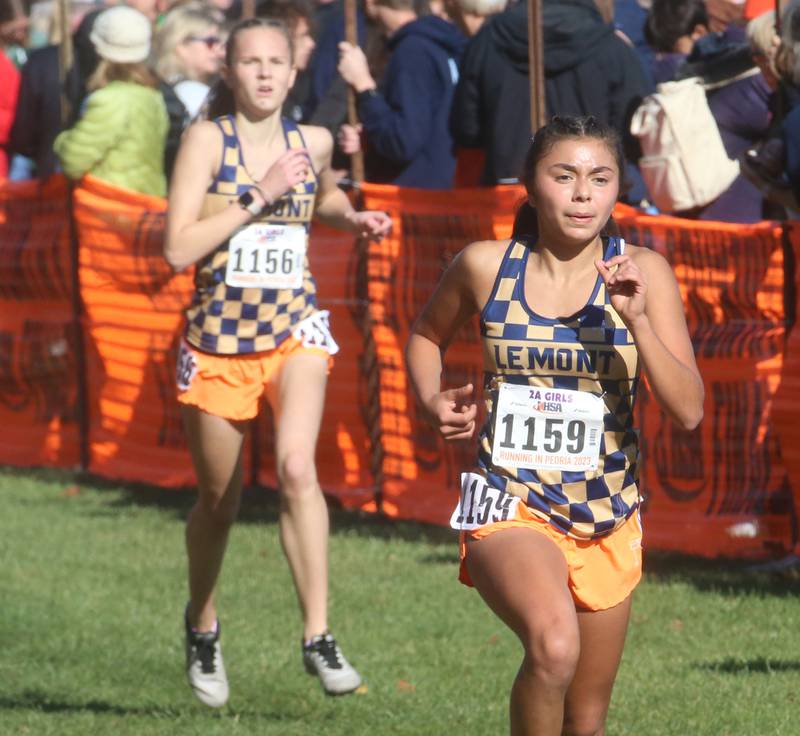 Lemont's Maya Fedko (left) and teammate Nora Galateo compete in the Class 2A State Cross Country race on Saturday, Nov. 4, 2023 at Detweiller Park in Peoria.