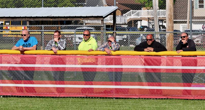 Softball dads line the fence during Thursday's Hall-Princeton game in Spring Valley.
