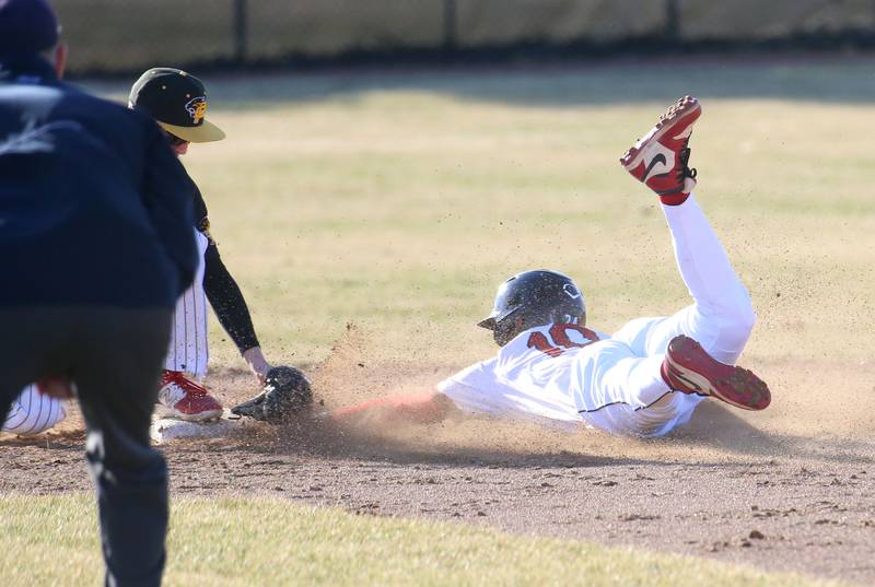 Hall's Jaxon Pinter steals second base against Putnam County on Monday, March 17, 2025 at Putnam County High School.