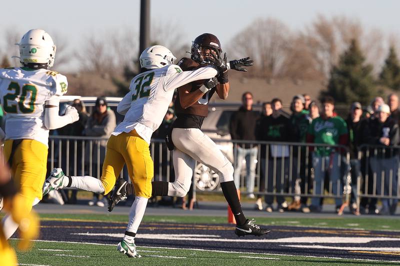 Joliet Catholic’s Adrain Washington makes a contested catch for a touchdown against Providence in the Class 5A semifinal on Saturday, Nov. 18, 2023, in Joliet.