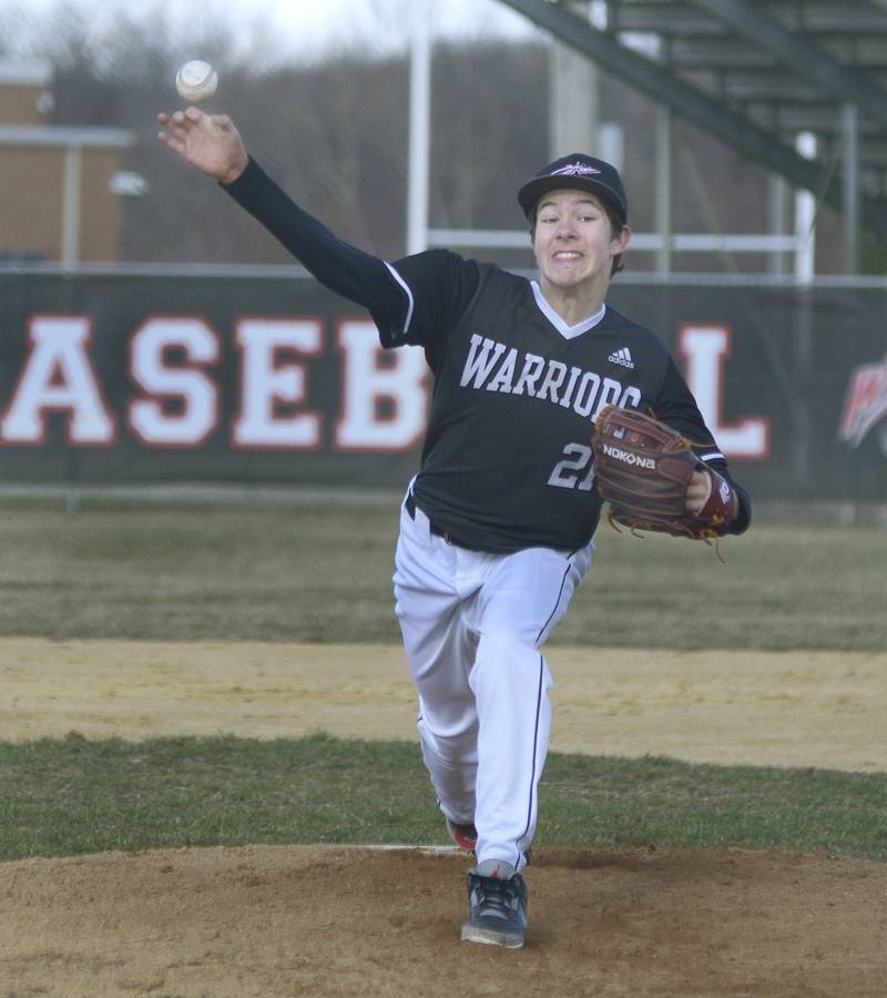 Woodland Pitcher Reece Pelnarsh  fires a pitch against Roanoke Benson after coming in relief in the 2nd inning Tuesday at Woodland .