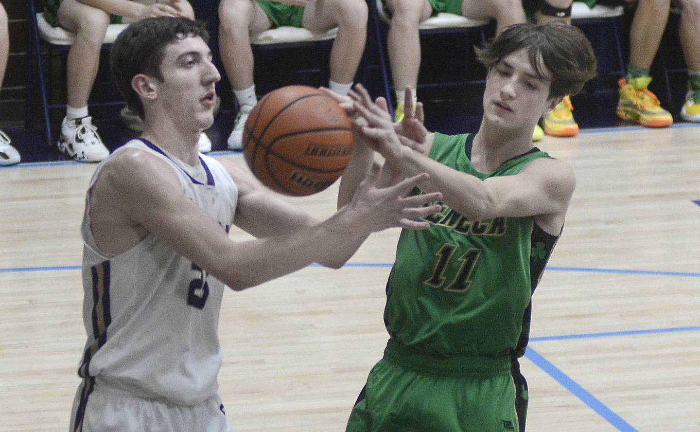 Serena’s Richie Armour and Seneca’s John Farcus battle over a rebound in the fourth quarter of Wednesday's semifinal at the Marquette Christmas Tournament at Bader Gym in Ottawa. - 12/28/22