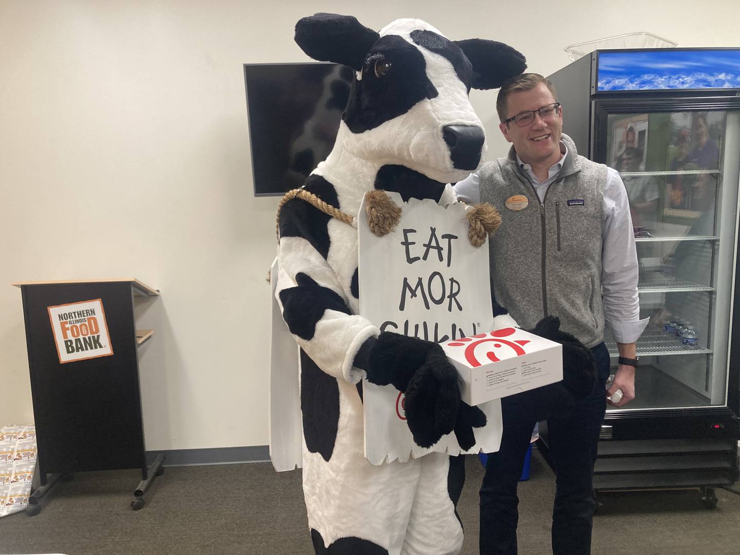 Joliet Chick-fil-A owner Kris Yoder and Cow at the visit to the Joliet location of the Northern Illinois Food Bank on Monday, Nov. 24, 2025.