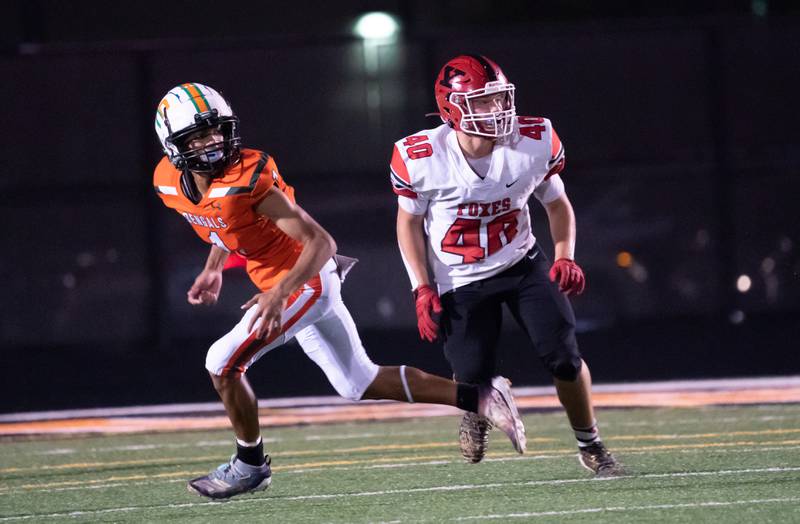 Yorkville's Blake Kersting, right, drops back in coverage against Plainfield East's Quinn Morris during a game Sept. 17 in Plainfield.
