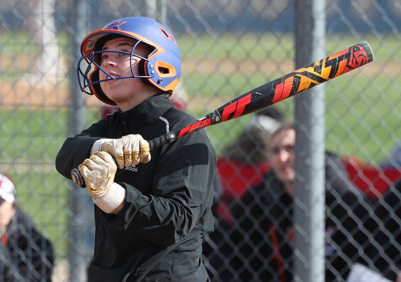 Genoa-Kingston’s Elizabeth Davis watches as her ball travels to left field during their game against Winnebago Monday, April 21, 2025, at Genoa-Kingston High School.