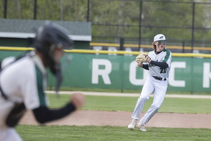 Rock Falls’ Cadon Schulz throws to first from third base for an out against Oregon Tuesday, May 2, 2023.