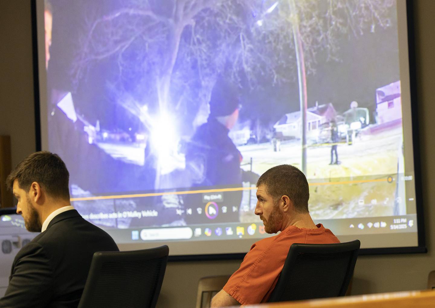 Body cam footage is show as defendant Kyle Cooper appears  Wednesday, May 14, 2025, in Whiteside County Court.