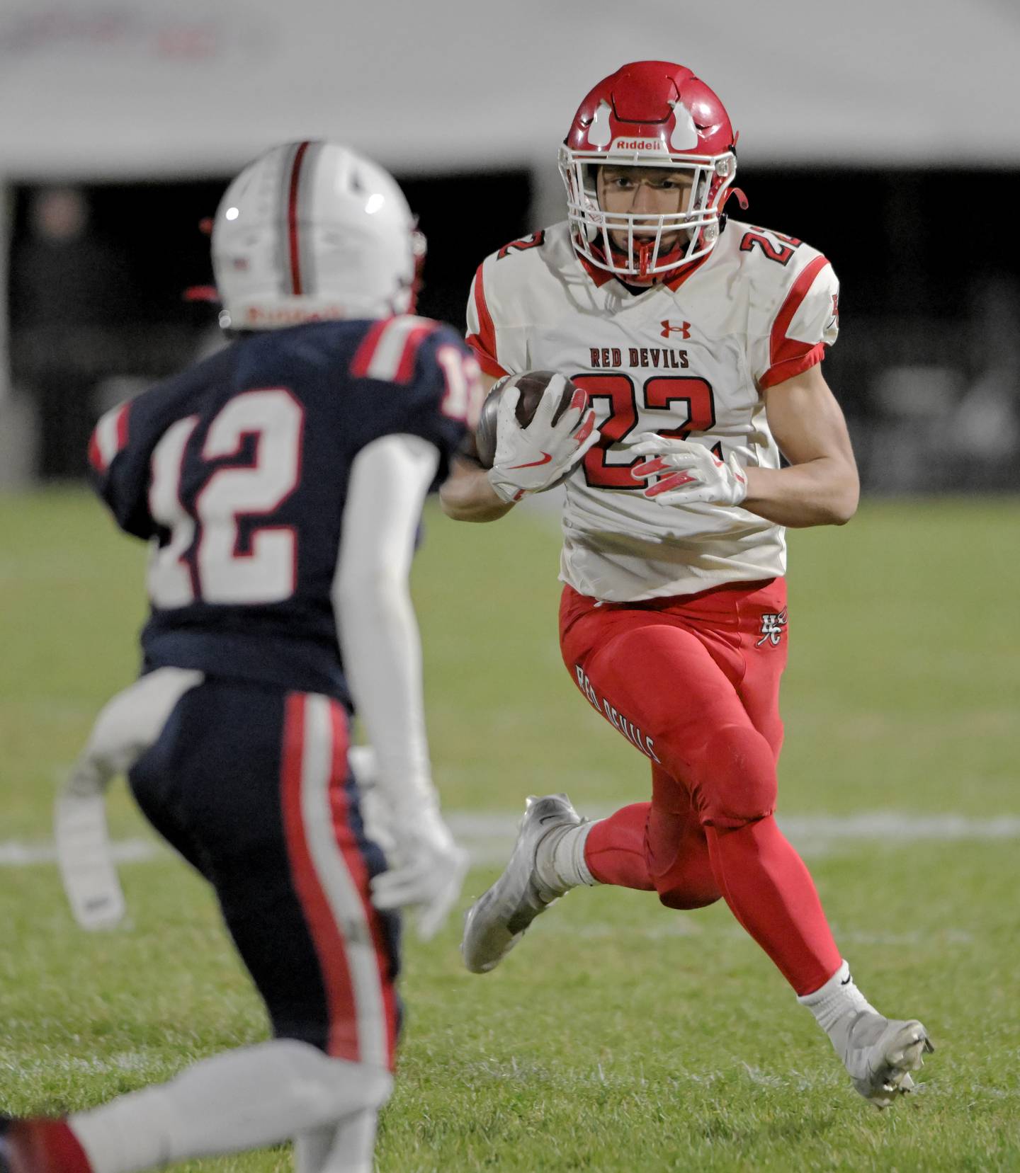 Hinsdale Central’s Dominic Tresslar looks for a way around South Elgin’s Semaj Collier in an IHSA Class 8A playoff football game in South Elgin on Friday, Oct. 31, 2025.