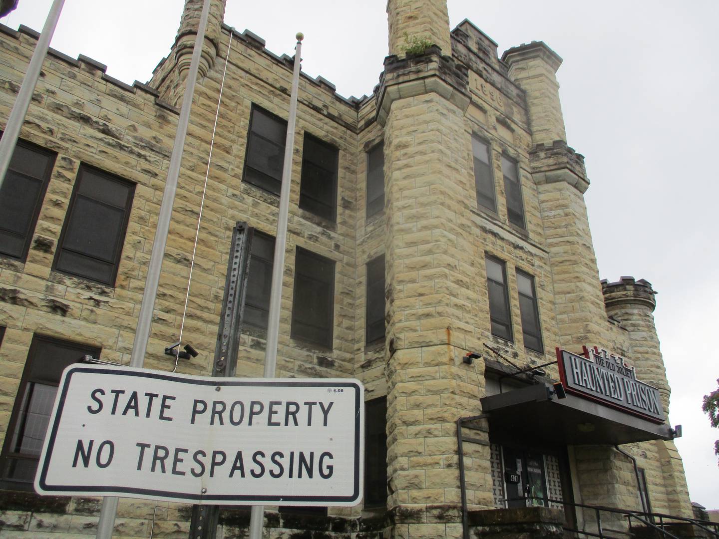 A sign outside the former women's prison section of the Old Joliet Prison wants against trespassing. Sept. 17, 2023.