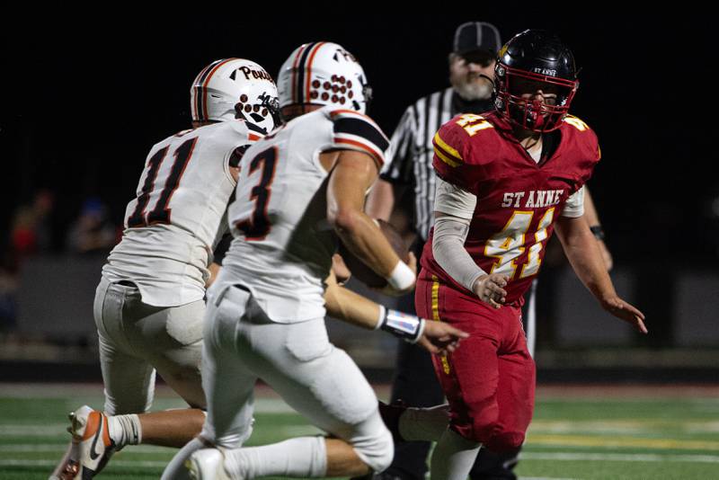 St. Anne's Nathan Brammer, right, looks to make the tackle as South Fork's Brodey Vanhooser, left, carries the ball on a play in a game on Friday, Spetember 26, 2025.