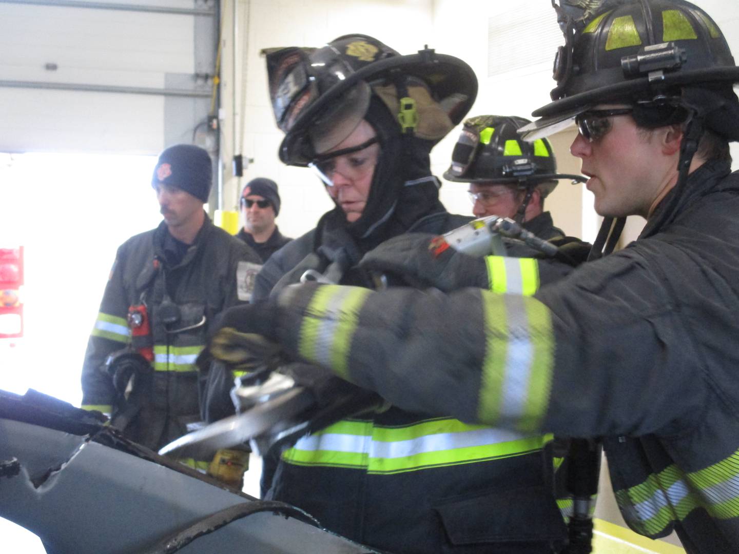 Oswego Village Board Trustee Jennifer Jones Sinnott uses a high-power tool for cutting open an automobile during a training session with the Oswego Fire Protection District on March 19, 2022 at the Montgomery station. (Mark Foster -- foster@shawmedia.com)