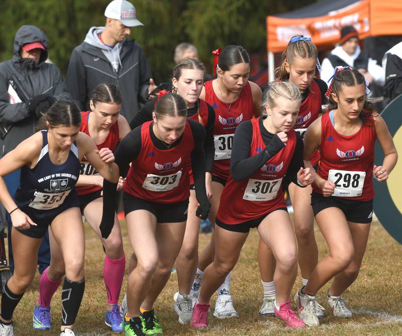 Oregon cross country runners start their race at the 1A Winnebago Girls Regional on Saturday, Oct. 25, 2025 at the Levi and Ester Fuller Memorial Forest Preserve.