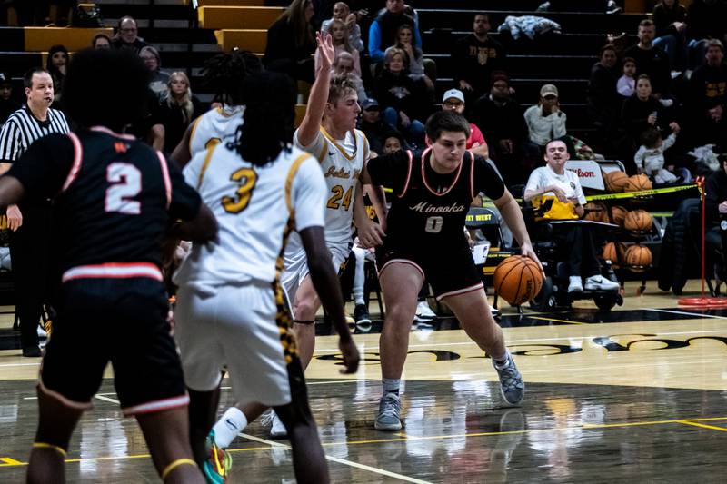 Minooka's Jackson Miranda drives to the basket during a varsity boys basketball game against Joliet West at Joliet West on Jan. 6, 2026.