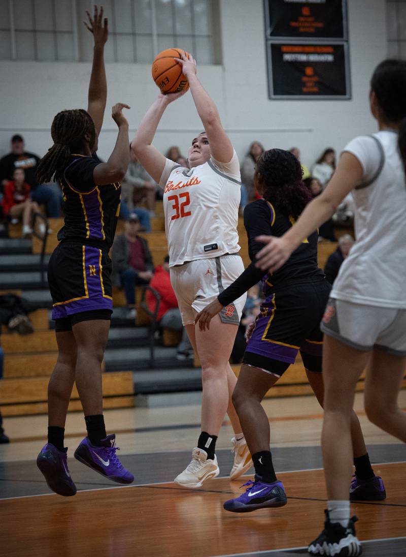 Beecher's Molly Vladika, center, turns and takes a shot against TF North in the Beecher Fall Classic on Tuesday, November 18, 2025.