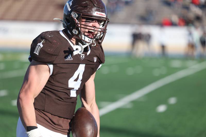 Joliet Catholic’s Nico Ronchetti celebrates his fumble recovery against Providence in the Class 5A semifinal on Saturday, Nov. 18, 2023, in Joliet.
