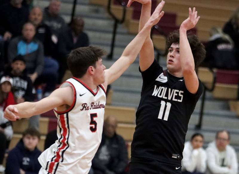 Prairie Ridge’s Ben Gablenz drains a three pointer in varsity boys basketball on Tuesday, Feb. 18, 2025, at  Huntley High School in Huntley.