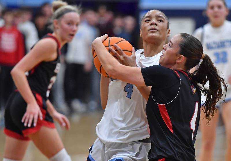 Nazareth’s Mia Gage is tied up by Benet’s Ava Mersinger (right) during a game on December 13, 2025 at Nazareth Academy in LaGrange Park.
