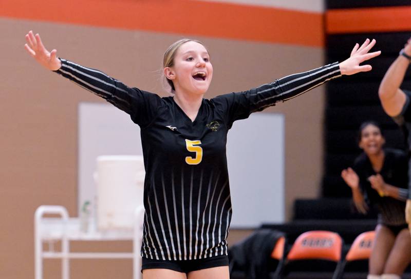 Metea Valley's Sienna Bialek (5) celebrates a point against DeKalb during a game in DeKalb on Thursday, Oct. 23, 2025.
