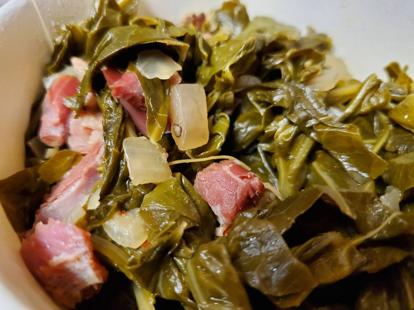 Station One Smokehouse in Plainfield prepares its spicy collard greens with bits of meat and onions.