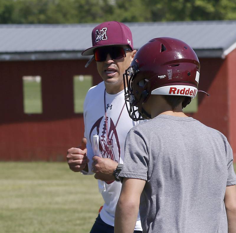 Marengo Head Coach Paul Forsythe talks to a play as he runs a drill during summer football practice Monday, June 27, 2022, at Marengo Community High School in Marengo.
