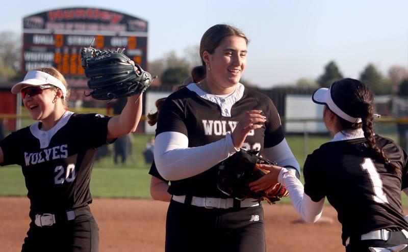 Prairie Ridge’s Reese Mosolino, front, and Emma Dallas, left, leave the field after a 4-2 win in varsity softball at Huntley High School in Huntley on Monday, May 5, 2025.