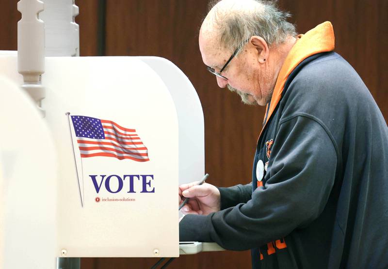 DeKalb resident Steve Walt makes his selections on Election Day Tuesday, April 4, 2023, at the polling place in Barsema Alumni and Visitors Center at Northern Illinois University in DeKalb.