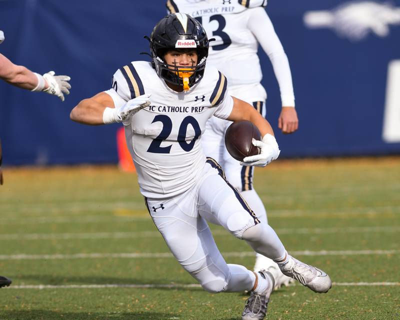 IC Catholic Prep's KC Kekstadt (20) runs the ball during the game against Chicago Hope Academy during the first round of 3A playoff football game on Saturday Nov. 1, 2025, held at Altgeld Park in Chicago.