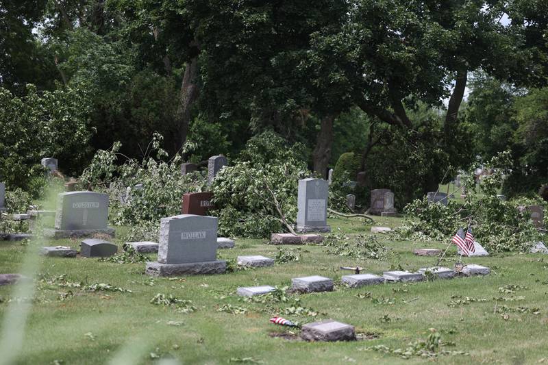 Tree branches are still seen thrown about Mount Moriah Cemetery Monday afternoon after Saturday’s severe storms in Joliet. Monday, July 22, 2022 in Joliet.