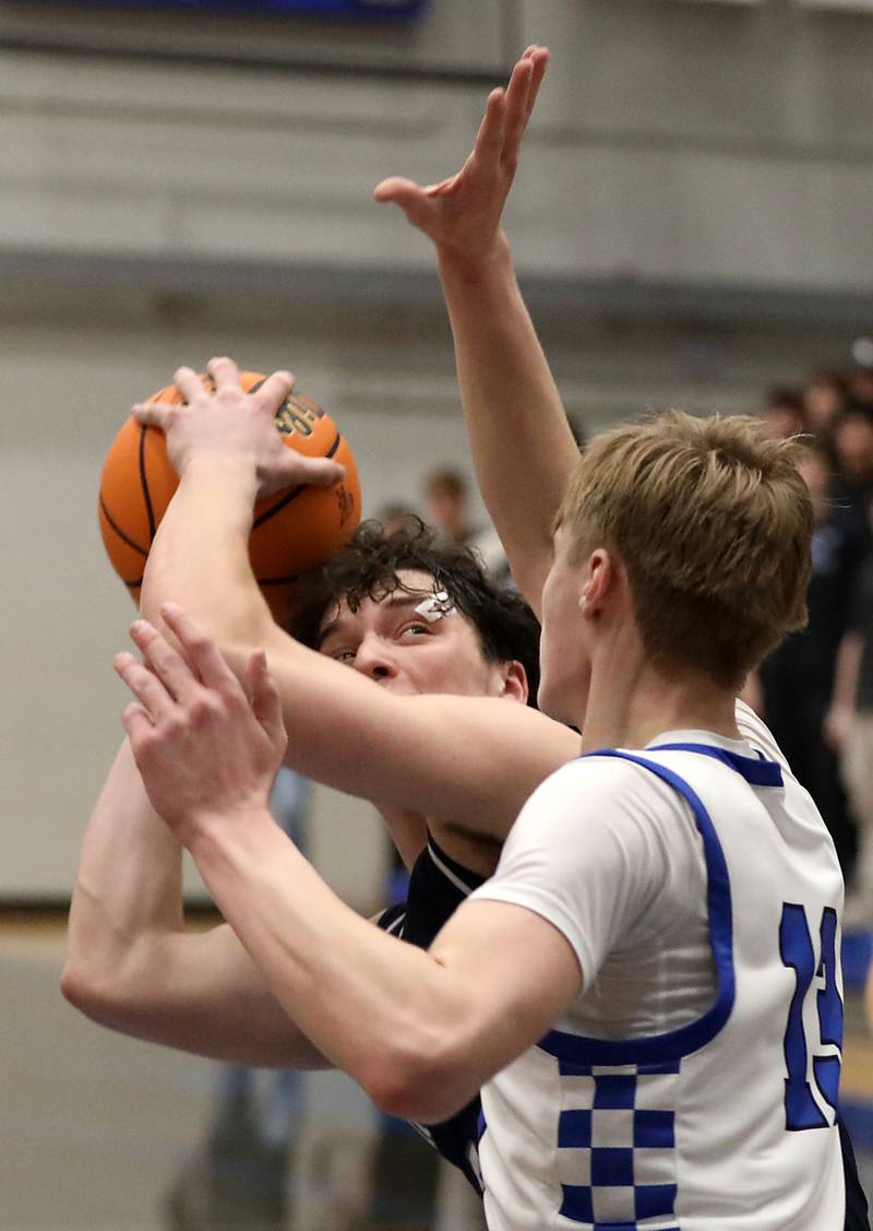 Cary-Grove's Adam Bauer looks to shoot as Burlington Central's Declan Wilson defends during a Fox Valley Conference boys basketball game on Friday, February. 6, 2026, at Burlington Central High School.