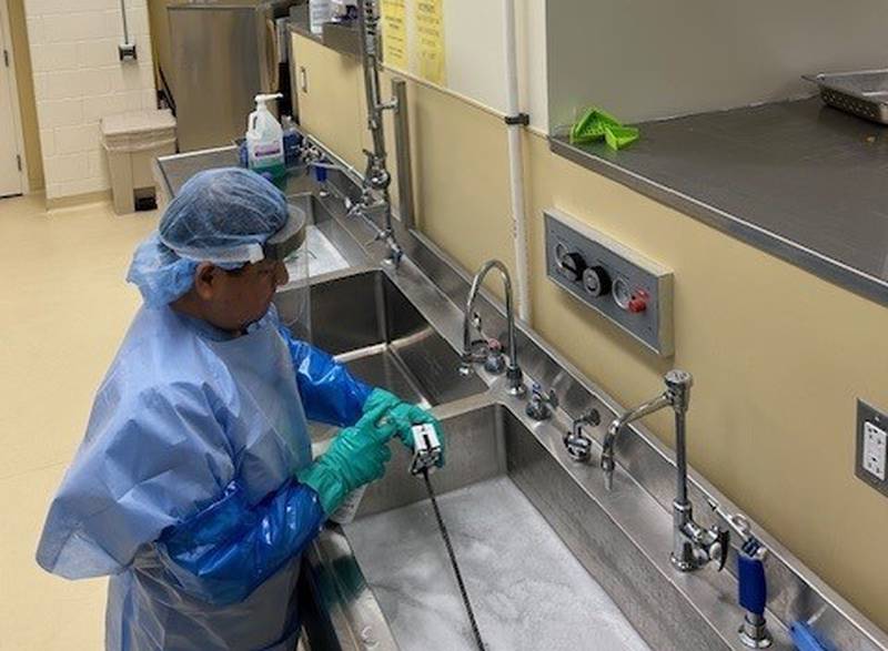Silver Cross Sterile Processing Technician Miguel Vega Roca uses the new Puro UV Disinfection Lighting during the disinfection and sterilization process.
