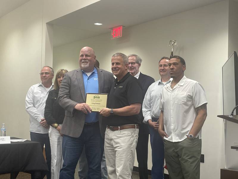 Outgoing DeKalb Ward 4 Alderman Greg Perkins is recognized by the council April 28, 2025, with a plaque for six years of service.