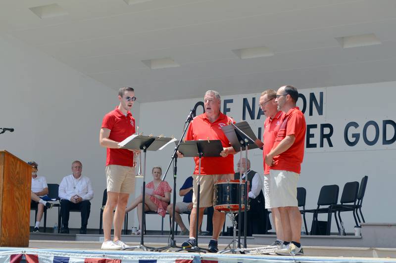 Barbershop quartet Three Batons and a Shovel perform from the Warren G. Reckmeyer Bandshell stage in Mt. Morris during the village's annual Let Freedom Ring patriotic program on July 4, 2023. Quartet members are Miles Beske, Andy Eckardt, Zach Hall and Mark Tremble.