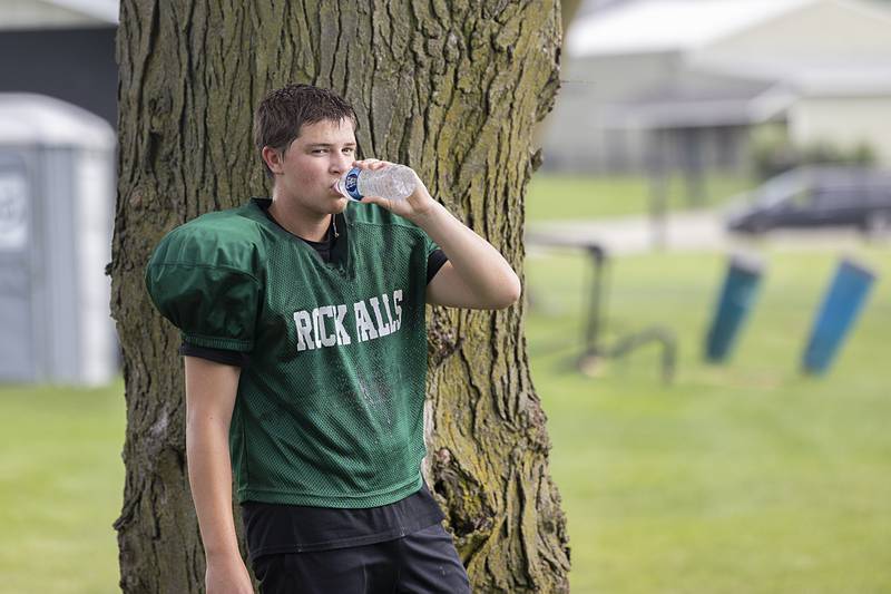 Carson Grove grabs a drink Tuesday, July 16, 2024, at Rock Falls football camp.
