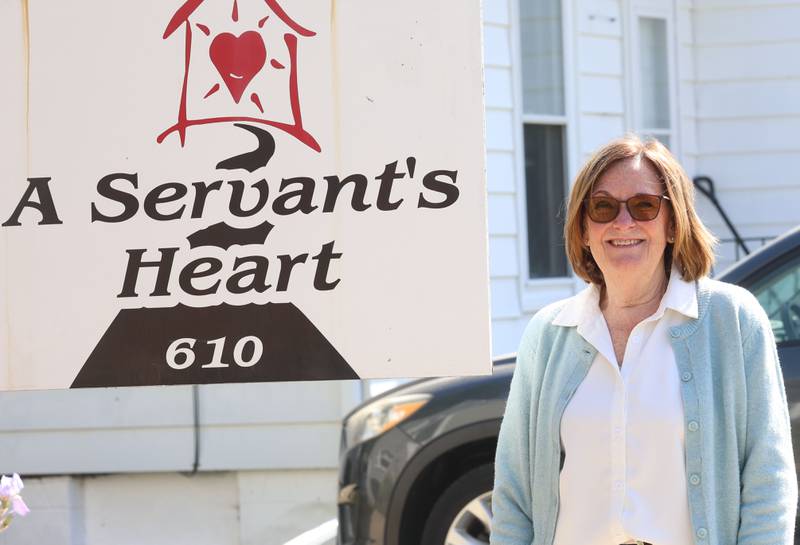 Karen Hall stands next to the A Servant's Heart sign on Tuesday, May 12, 2026 in Ottawa.