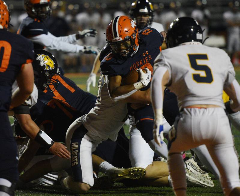 Naperville North’s Rahsean Blake-Eiland (13) scores a touchdown against Neuqua Valley during a football game played on Friday, Oct. 11, 2024 in Naperville.