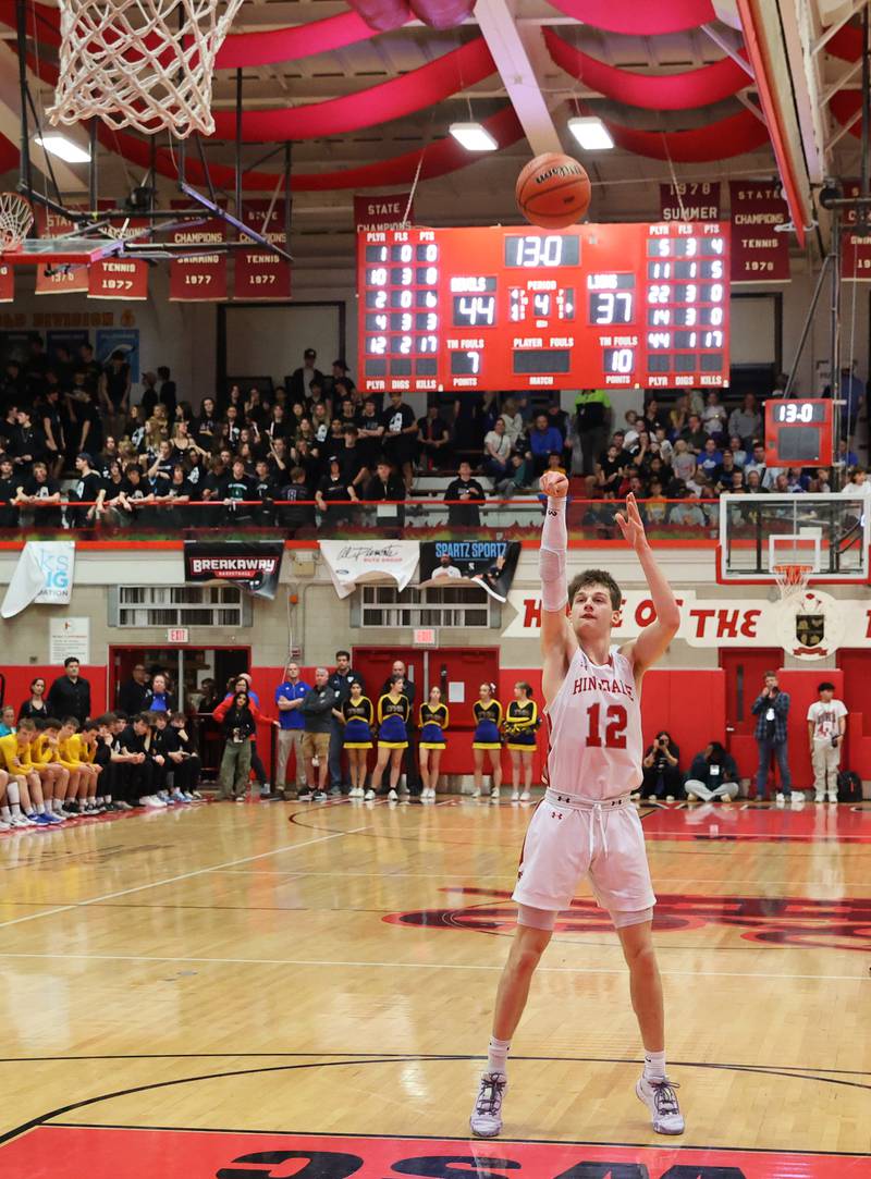 Hinsdale Central's Ben Oosterbaan (12) takes a free throw with 13 seconds left during the boys 4A varsity sectional semi-final game between Hinsdale Central and Lyons Township high schools in Hinsdale on Wednesday, March 1, 2023.