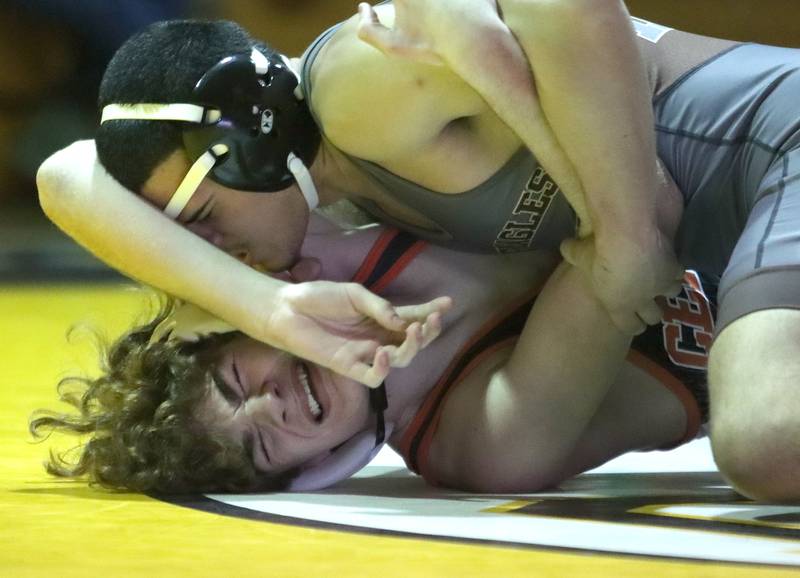 Jacobs’ Nathan Gomez, top, battles Crystal Lake Central’s Richie Butler at144  pounds in varsity wrestling on Thursday, Jan. 16, 2025, at Jacobs High School in Algonquin.
