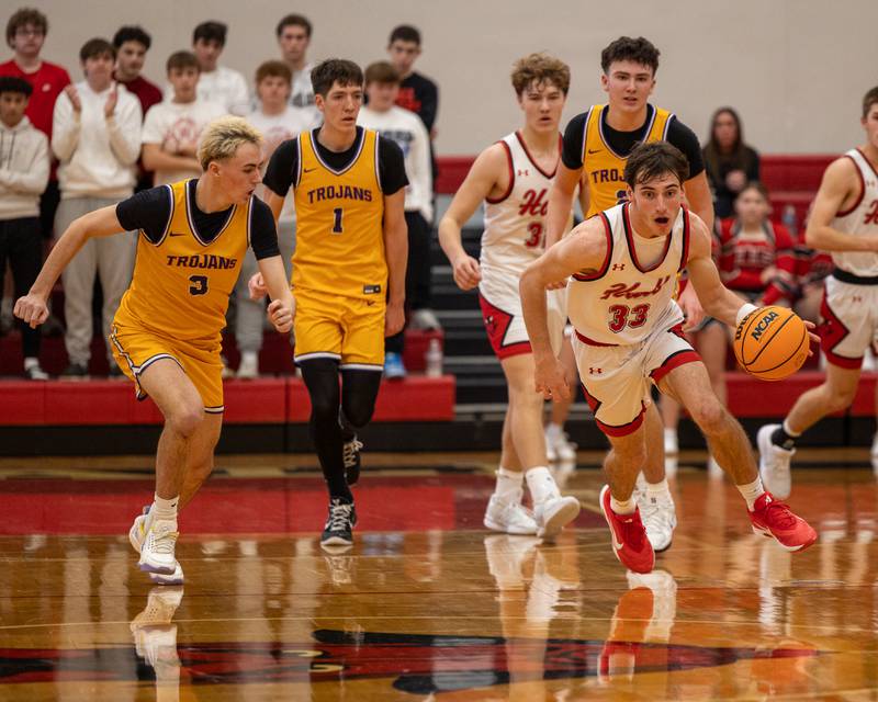 Braden Curran (33) of Hall dribbles ball down court in the championship game of the Colmone Classic on Saturday, December 20, 2025 at Hall High School in Spring Valley.